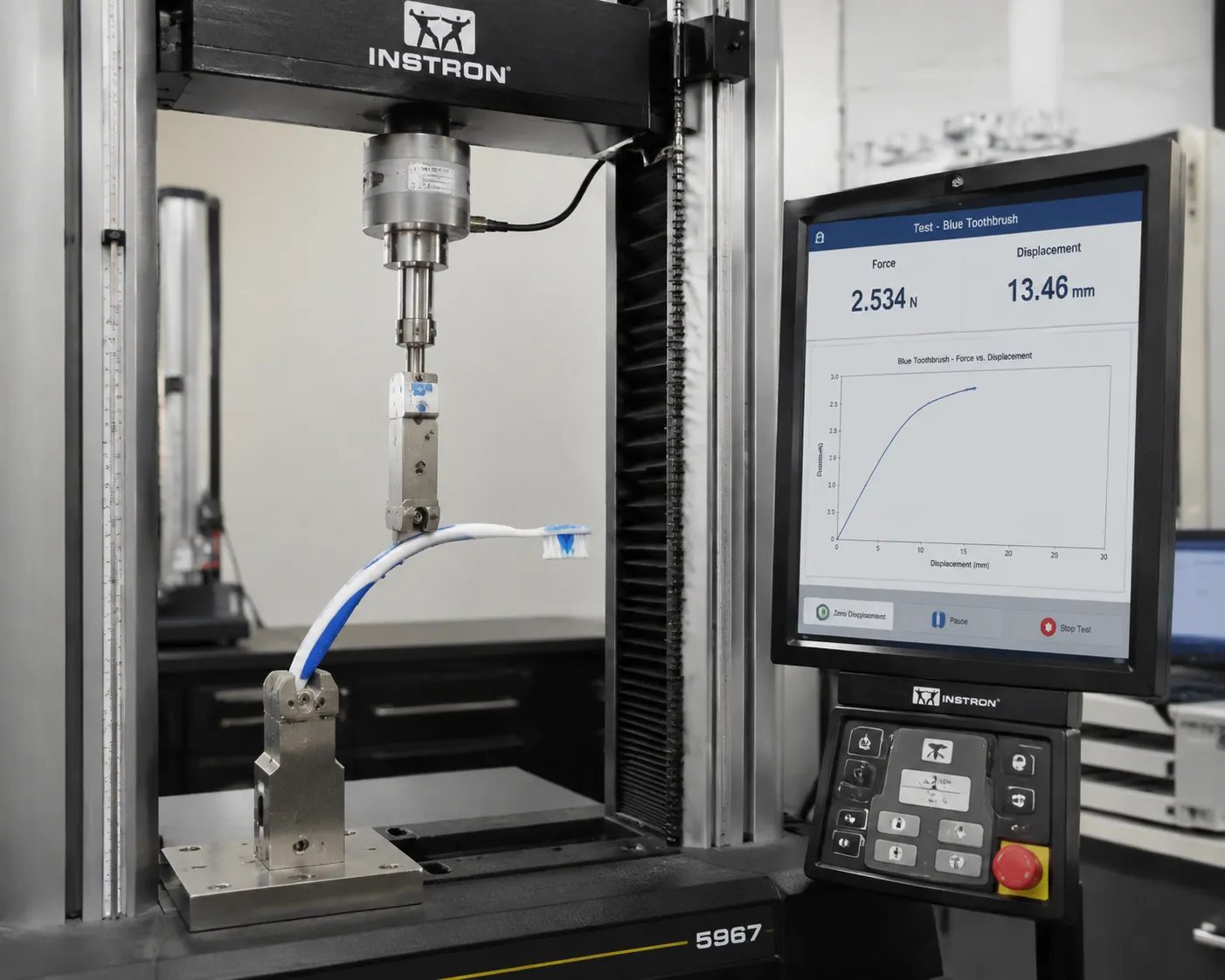 Universal testing machine measuring toothbrush flexibility and deflection with force and displacement measurement