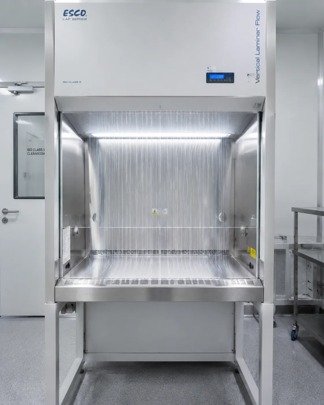 Clean bench testing — vertical laminar flow clean bench with HEPA filter and unidirectional downflow over the work surface.